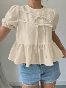 Elenzga Blusa feminina de verão, cor sólida, gola redonda, manga curta bufante, laço frontal, estilo babydoll, branca, com babados, creme, com laço frontal, estilo babydoll. Blusa feminina marfim. Blusa feminina branca. Roupas femininas. Blusas femininas de verão. Blusas femininas fofas para o verão. Blusas femininas casuais. Blusas femininas elegantes. Novidades em blusas femininas. - Damasco - Ver 3