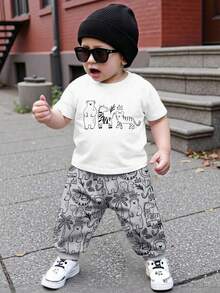 Bubblio 男婴休闲宽松舒适短袖T恤和裤子套装（2件套），适合春夏穿着，经典可爱印花图案包括斑马、老虎、棕熊、狮子、松鼠、河马、大象等卡通动物。 - 彩色 - 查看 2