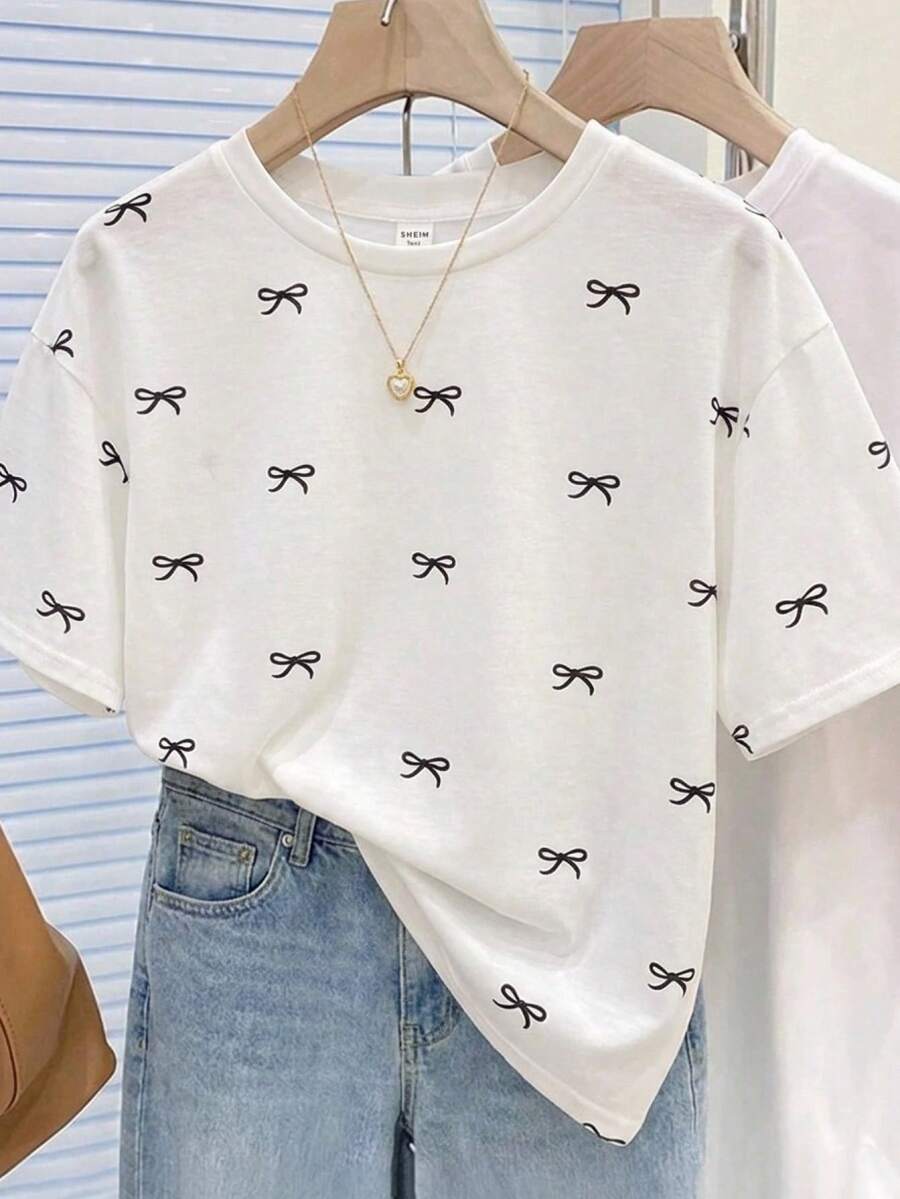 SHEIN Kids Teen Girls T-Shirts Regular Loose Fit Butterfly Print Popular T-Shirt Cute Tops Aesthetic Shirts Aesthetic Teen Girl Shirts Cute T Shirt Bow Print Shirt - Black and White - View 1