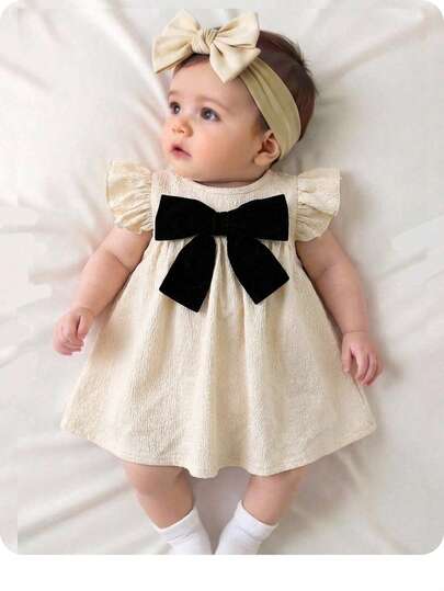 新生女宝宝优雅可爱杏色纹理蝴蝶结装饰短袖连衣裙