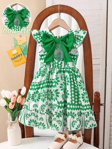 SHEIN Elladie kids 女童春夏新款休闲时尚连衣裙，绿色花卉数码印花图案，圆领无袖荷叶袖，露背镂空设计，绿色3D蝴蝶结装饰，腰部褶皱荷叶边下摆，适合可爱、舒适、优雅的小女孩日常穿着，也适合上学、外出、度假、派对等场合。绿色花卉女童连衣裙，女童复活节连衣裙，女童绿色套装，女童蝴蝶结连衣裙，女童绿色蝴蝶结，女童度假套装，女童夏季连衣裙，优雅派对连衣裙，夏季套装。 - 綠色 - 查看 5