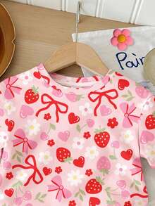 SHEIN Bộ 2 món cho bé gái, gồm áo thun ngắn tay cổ tròn dáng rộng thoải mái in hình dâu tây, trái tim, hoa và nơ, chất liệu mềm mại, thích hợp cho mùa xuân, hè, mặc hàng ngày, ở nhà, đi chơi, nghỉ lễ, lễ Phục sinh, đi nông trại, dã ngoại. - Nhiều màu - Xem 4