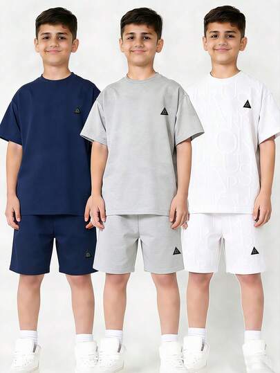 SHEIN Buy 4 Get 2 Free, 6pcs Tween Boy Casual Solid Color Textured Fabric Short Sleeve Crew Neck T-Shirts And Contrast Letter Print Elastic Waist Shorts Set, Suitable For Autumn/Spring, Outdoor Play, School, Street Style, Party And Leisure, High Cost-Performance