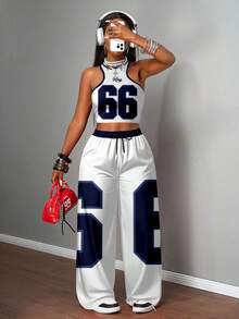 Slaydiva Bộ đồ nữ phong cách đường phố thường ngày gồm áo hai dây ôm sát và quần ống rộng, phù hợp để mặc dạo phố với họa tiết in số 66 phối màu xanh trắng. - Nhiều màu - Xem 3