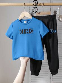 SHEIN 2-Piece Set Of Young Boys Casual Sport Casual Street Style English Pattern Fitted Round Neck Short Sleeve T-Shirt And Black Long Pants Set Suitable For Kids Outfits Toddler Boy Clothes Back To School Boys Set Suitable For Birthday Parties, Parties, Performances, Weddings, Baptisms, Back To School Daily Suitable For School Suitable For Travel Suitable For Sports Suitable For Spring And Summer - Blue - View 2
