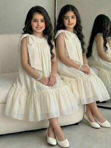 SHEIN Tween Girl Elegant Solid Apricot Organza Bow Decor Halter Neck Ruffle Hem A-Line Dress Elegant Solid Color Dress Cream Dress For Girls Ivory Dress For Girls Girls Bow Dress Girls Ruffle Trim Dress Picnic Dress Aesthetic Dresses For Summer Girls Ruffle Dress Girls Cream Girls Dress Ivory Dress Girls Beige Dresses For Girls Cream Dresses For Kids Ivory Or Champagne Dress For Tween Long Beige Dress Kids Girls Elegant Dress Soft Yellow Elegant Off-White Dress For Tweens - Apricot - View 5
