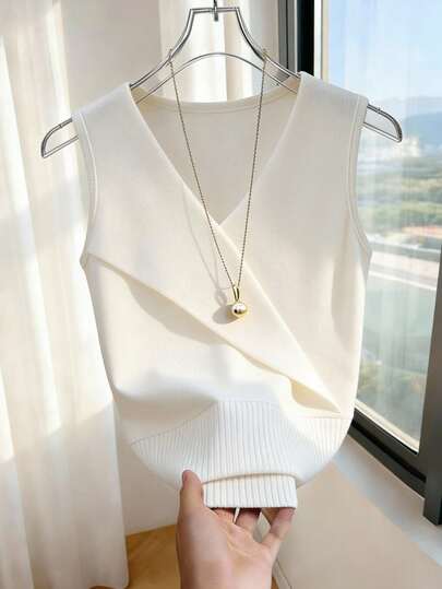 Franclia This Sophisticated V-Neck Knitted Tank Top/Tank Top Features A Slimming, Asymmetrical Design For A Subtle Touch Of Style. It's Perfect For Spring And Summer, Worn Alone Or Layered. A Solid Color Sleeveless Tank Top For Women, Suitable For Spring And Summer, Sexy Women's Tank Tops, Sleeveless Tops, Spring Clothing, Summer Outfits, Women's White Tops, And Women's White Tank Tops.Fashionable Casual Commuter Wear, Business Office Wear, Versatile And Stylish Everyday Casual Wear, Urban Teacher's Professional Attire