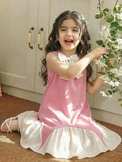 This Single-Piece Sleeveless Dress Designed For Young Girls Comes In A Charming Rose-Pink And Beige Color-Block Style, Featuring A Ruffled Hem And Delicate Bow Decorations, Which Boasts A Minimalist And Elegant Look And Is Ideal For Daily Wear, Banquets, Parties, And Various Occasions To Make Your Little Girl Look Like An Adorable Arabian Little Princess.