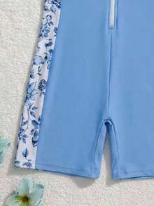 SHEIN Áo tắm liền thân họa tiết hoa lá phối màu xanh dương dành cho bé gái tuổi teen, thích hợp đi biển mùa hè. - Xanh và trắng - Xem 6