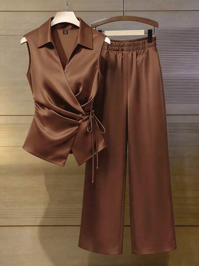 Franclia Women's Elegant And Casual Brown Satin Satin Shirt With Tie Collar And Sleeveless Design, Paired With Loose Elastic Waist Trousers. Suitable For Summer And Spring Wear, Beachwear, Wedding Guest Suits, Elegant Suits, Casual Two-Piece Sets, And Business Attire. Brown Clothing. Pants And Top Set Blouse And Pants Set Brown Satin Set Women Silk Pants Satin Pants Set Brown Clothes Brown Set Women Suits For Woman Set Vest And Pants Set