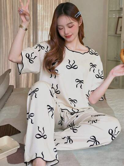 1 Conjunto de pijama para adolescentes, base color albaricoque con estampado de mariposas, ribete de contraste, manga corta y pantalón largo, conjunto de ropa de estar en casa informal