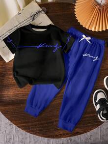 Bộ quần áo 2 món in chữ cho bé trai, áo thun cổ tròn màu đen và quần dài màu xanh thời trang và thoải mái, áo tay ngắn và quần dài cho bé trai, phù hợp cho mọi mùa. - Nhiều màu - Xem 2