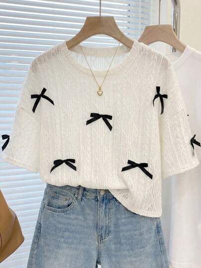 Blusa de manga corta de cuello redondo holgado de unicolor con decoración de lazo texturizado en melocotón, adecuada para uso casual, dulce y diario, para adolescentes