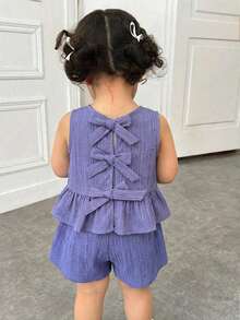 SHEIN Bộ đồ đôi cho bé gái màu tím nhạt dễ thương, có nơ trang trí, kiểu dáng thoải mái, thích hợp cho kỳ nghỉ, gồm áo hai dây và quần short, màu xanh tím nhạt, kiểu dáng hở lưng, thích hợp cho trẻ em. - Màu tím - Xem 9
