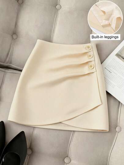 GlowEve 女士内置打底裤半身裙，时尚休闲半身裙，通勤风半身裙，纽扣装饰，低腰褶裥设计，不对称裙摆，春夏款，适合日常外出和办公穿着。