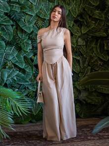 Andrea Bello 2 件/套 2025 春夏新品系列音乐节、复活节、圣帕特里克节、西部风格、游牧风格、生日派对、毕业季、学院风、学生装、日常休闲、基本百搭、休闲、度假、邮轮旅行、海滩、日光浴、病毒式、街头服饰、婚礼嘉宾波西米亚风格、通勤风格、早午餐装、机场装 - 米色不对称肩部设计褶皱下摆短款上衣和阔腿裤纹理面料两件套 - 杏色 - 查看 4