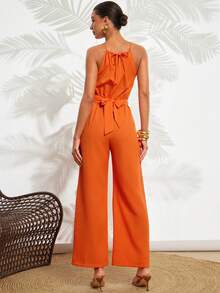 Gownix Damen eleganter orangefarbener Romper mit Holzperlen-Knopfverzierung, strukturierter Streifenoptik, Überschneidung und Bindegürtel, gerade Beinform, geeignet für Urlaub, Pendeln, Dates, Ausflüge, vielseitig tragbar, Boho-Romper für Damen, orangefarbener Romper für Damen, rückenfreier Romper orange, Damen-Romper orange, Damen-Romper mit Trägerhals, orangefarbener Urlaubsoutfit, Urlaubsoutfits für Damen, Romper für Urlaub, Strandoutfits für Damen, Strandanzug für Damen, Urlaubsoutfit für Damen, ärmelloser Romper für Damen, Damen-Romper - Orange - Übersicht 3
