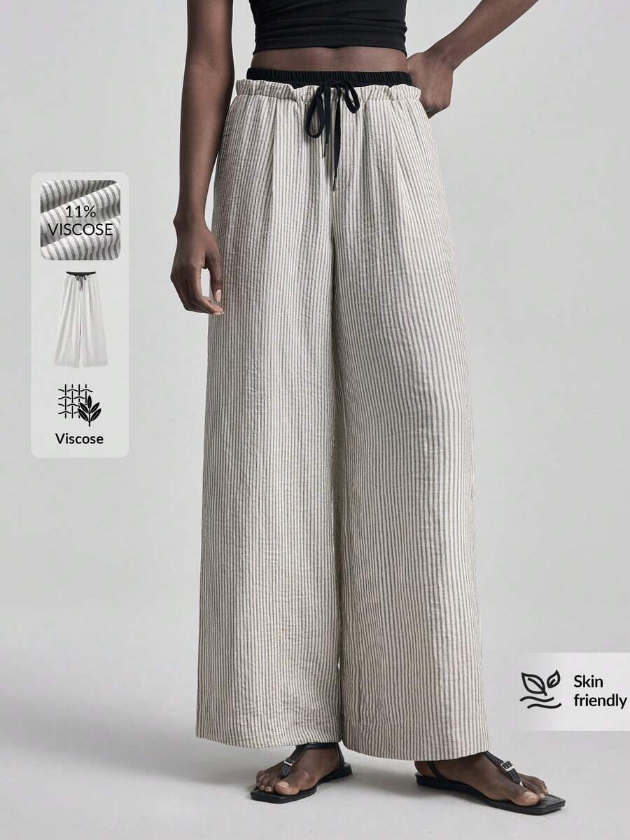 Ontre 2026春夏新款女裤，撞色腰带，条纹面料，褶皱面料，松紧腰带，阔腿裤，适合通勤、教师、夏季度假、都市时尚、简约通勤、婚礼宾客装扮、浪漫情人节、设计感十足、优雅、教师节、下午茶、派对、休闲宽松日常女装畅销阔腿裤、办公装、度假装、返校季轻度假风、日常穿着、女士春夏休闲装、时尚百搭女士宽松休闲裤 - 黑與白 - 查看 1