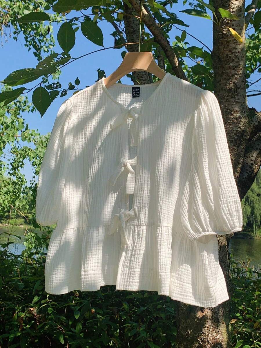 Đầm babydoll dáng rộng màu trắng trơn, thoải mái, đa năng cho bé gái tuổi teen, thích hợp mặc đi nghỉ mát mùa xuân/hè, kiểu dáng đồng quê, chất liệu cotton lanh, cổ tròn, tay phồng, có nơ, viền bèo nhún. - trắng - Xem 1