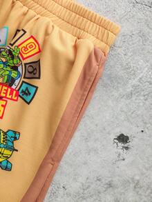TEENAGE MUTANT NINJA TURTLES | SHEIN Quần short nam in chữ, cạp chun, kiểu dáng thường ngày đa năng. - Màu vàng - Xem 5