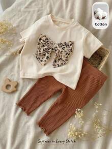 Cozy Pixies Ensemble 2 pièces pour nouveau-né fille : Top à manches courtes col rond en tricot avec nœud et pantalon à taille élastique - Multicolore - Voir 2
