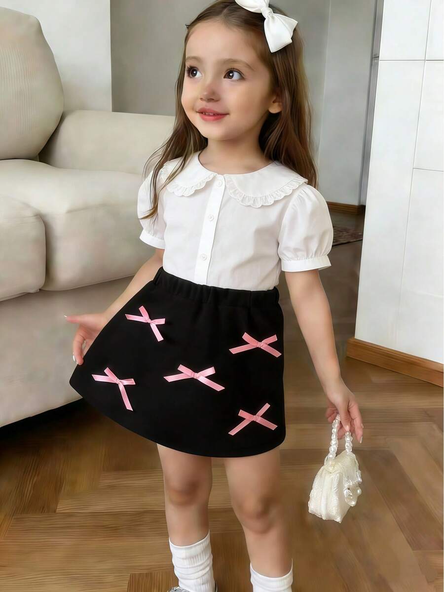 这款优雅的黑色女童半身裙,采用松紧腰带设计,正面饰有多个蝴蝶结,适合日常穿着、派对和正式场合。搭配上衣和外套,可打造精致出众的造型。 - 黑色 - 查看 1