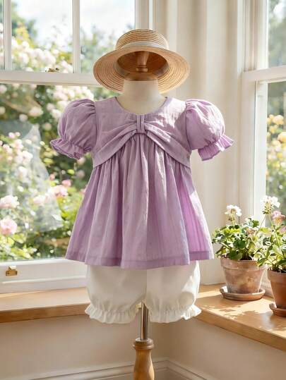 Souflis Souflis Bộ đồ mùa hè kiểu Pháp mới, áo không tay cổ nơ lớn bằng vải mềm mại màu tím oải hương, kết hợp với quần short dễ thương, thích hợp cho ở nhà, chơi đùa, mua sắm và các dịp khác, dành cho bé gái.