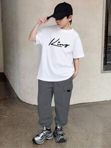 SHEIN Mirajuku 2pcs Tween Boys' Print Black Short Sleeve T-Shirt + Beige Cargo Pants Casual Suit, Spring/Summer - White - View 1