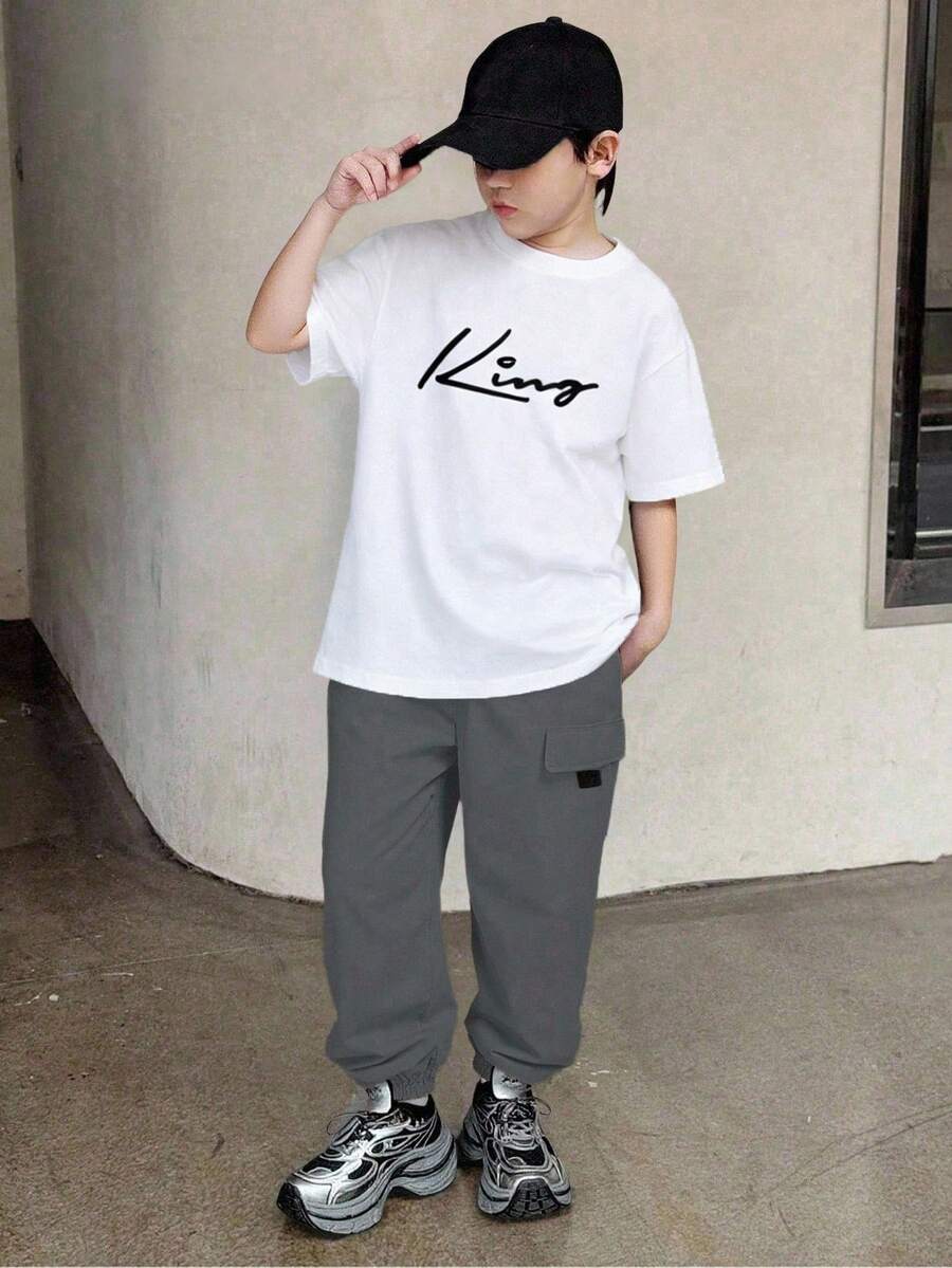 SHEIN Mirajuku 2pcs Tween Boys' Print Black Short Sleeve T-Shirt + Beige Cargo Pants Casual Suit, Spring/Summer - White - View 1