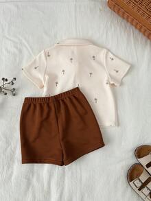 SHEIN Baby/Baby Boy Casual Cute Palm Tree Print Vacation Style Polo Collar Short Sleeve Shirt And Shorts Set, Spring/Summer Baby Boy Vacation Style Skirt Set Baby/Baby Boy Outfit Sets Hawaii Style Skirt Baby Boy Summer Polo Baby Summer Outfit Boy Baby Boy Polo Shirt Baby Boy Summer Outfit Polo Shirt For Baby Boy - Khaki - View 2