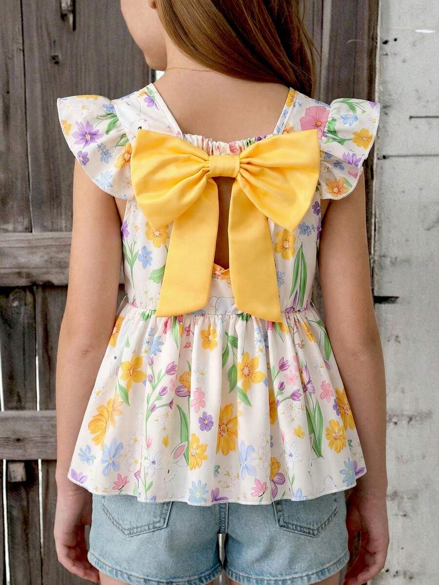 SHEIN Mädchen Top mit gelbem riesigem Schleifenbesatz und verspielten gerüschten Flügelärmel, frische Bonbonfarben Palette für ein fantasievolles Kleine Mädchen, lebendiger und schwungvoller Fotoshooting-Stil.