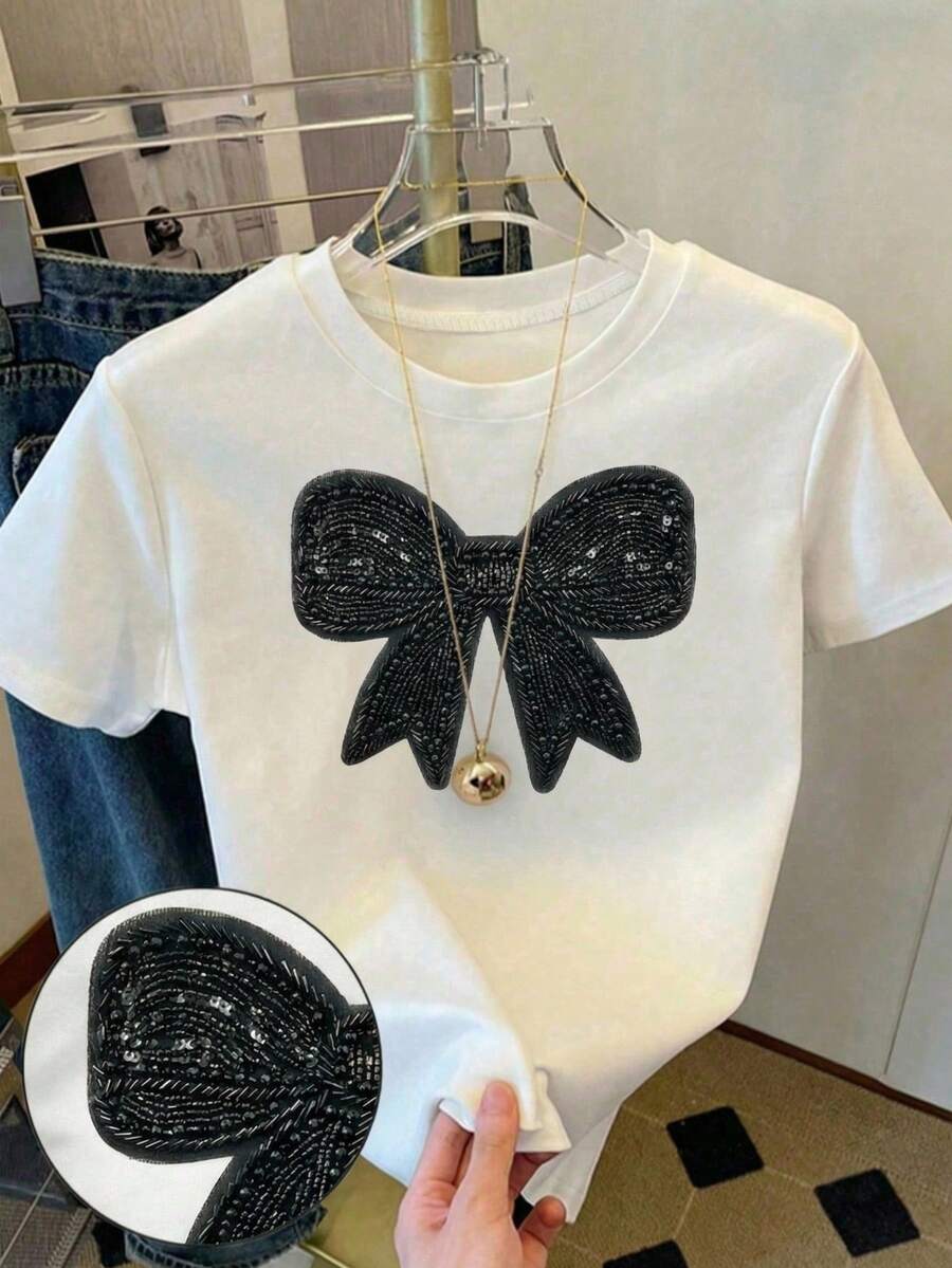 Camiseta corta y ajustada para niñas, con diseño de lazo de imitación de strass negro, versátil para combinar con todo, adecuada para salidas, uso en primavera/verano - Blanco - Ver 1