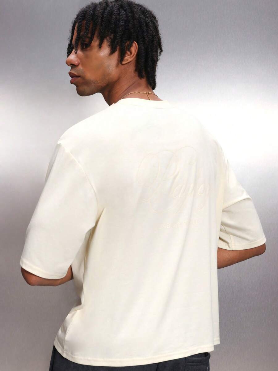 PLAYBOY X SUMWON Camiseta de cuello redondo de manga corta oversize de hombre en color crema, de uso casual y urbano, de mezcla de algodón, con ajuste relajado, para uso diario en verano y primavera - Albaricoque - Ver 1