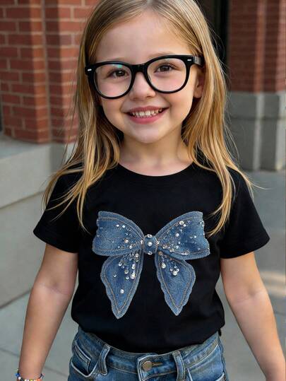 Camiseta de manga corta de verano para niñas bebé, con estampado gráfico, moño y efecto de lentejuelas falsas, de estilo minimalista, cómoda y casual