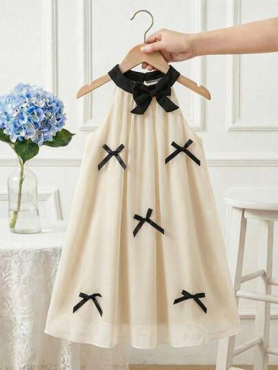 SHEIN 4-7岁女童甜美梦幻3D蝴蝶结雪纺吊带连衣裙，杏色，华丽独特，适合夏季、户外活动、度假、派对、春夏新款