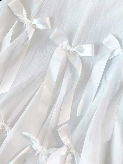 GlowEve CURVE A Youthful Atmosphere-Enhancing Netted Bow-Tie Vest With A Ruffled, Sleeveless Top.