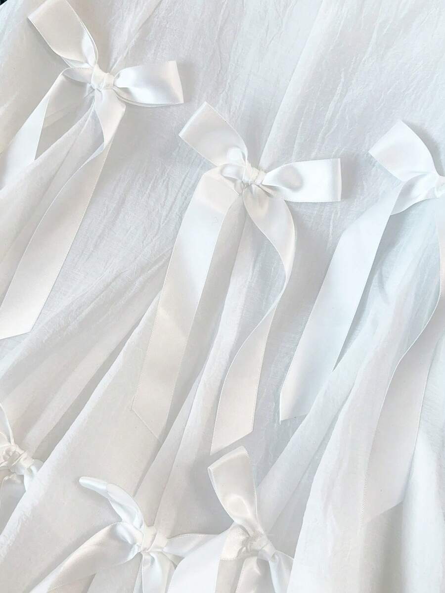 GlowEve CURVE 一款增添青春气息的网状蝴蝶结背心，搭配荷叶边无袖上衣。 - 白色 - 查看 1