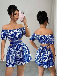 Elenzga Women's Summer Vacation Casual Blue & White Floral Off Shoulder Petal Sleeve Hollow Waist Romper - Blue and White - View 1