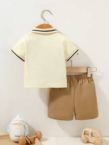 SHEIN Set de 2 piezas para bebé niño recién nacido | Camisa polo de manga corta blanca + pantalones cortos caqui, de algodón, casual, elegante y cómodo, adecuado para vacaciones/fiestas, salidas, sesiones de fotos - Multicolor - Ver 2