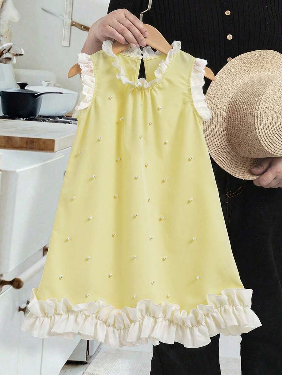 SHEIN Elladie kids 这款连衣裙采用简约的无袖圆领设计,尽显清爽优雅。上身饰以立体网纱花朵,花蕊点缀仿珍珠,更添精致吸睛之感。自然的褶裥设计,令裙摆轻柔飘逸,随着动作摇曳生姿,散发出端庄优雅的气质。这款精致优雅的连衣裙非常适合婚礼、钢琴演奏会、生日派对等正式场合的花童穿着。搭配平底鞋,也能轻松打造甜美淑女的日常造型,尤其适合春秋季节穿着。 - 黃色 - 查看 1