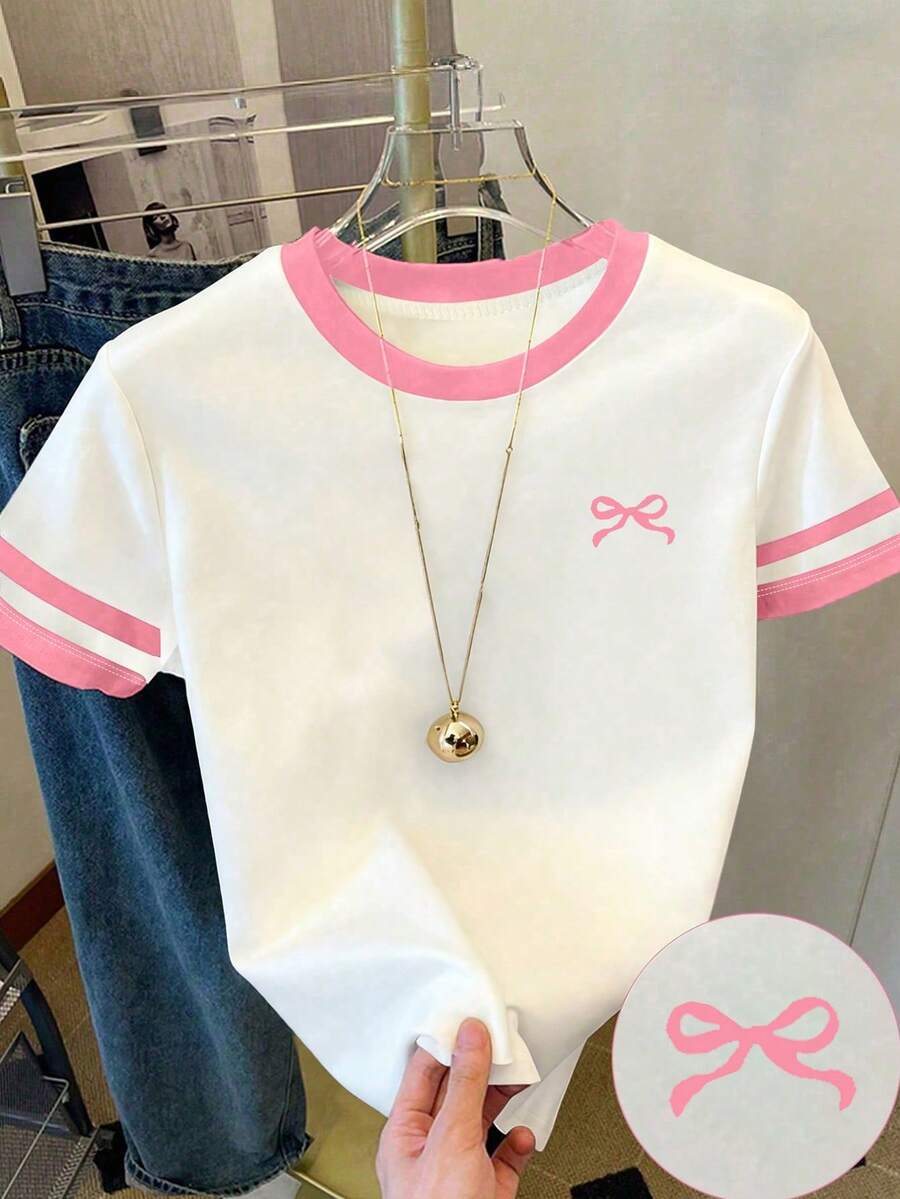 Áo thun ngắn tay cổ tròn dáng rộng dễ thương cho bé gái tuổi teen, chất liệu polyester, in hình nơ và viền màu tương phản. Bộ áo thun đáng yêu, phù hợp cho các bé gái tuổi teen. - trắng - Xem 1
