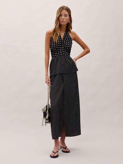 Nöista La parte superior de halter presenta un patrón clásico de lunares en blanco y negro con una cintura de peplum, creando una silueta favorecedora. Combínalo con pantalones o faldas para ocasiones versátiles. Ideal para eventos nocturnos, primavera, verano, look nocturno, mujer, atuendo de mujer.