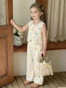 SHEIN Conjunto de 2 piezas de top sin mangas con volantes en forma de corazón y pantalones 3/4 para niñas, adecuado para salidas y vacaciones - Multicolor - Ver 1