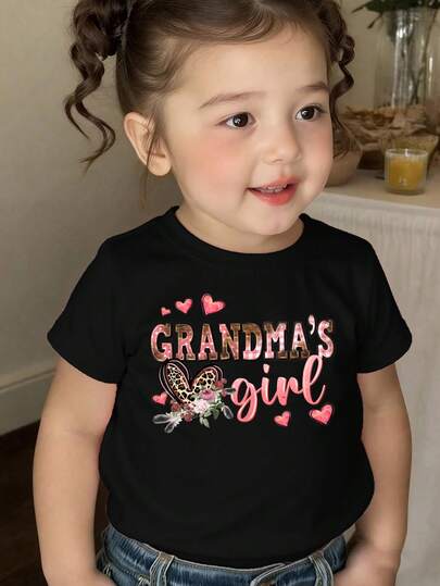 SHEIN Spring And Summer Infant Girls' Casual Fashionable Creative Personality Refreshing Minimalist Cute Kawaii Leopard Print, Heart, Floral, Polka Dot, Plaid, Letter Graphic Print Casual Basic Black Short T-Shirt, Comfortable Daily Wear, Cozy Summer And Fall Styles Suitable For Spring, Summer, Autumn