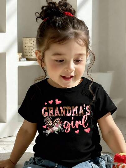 SHEIN Spring And Summer Infant Girls' Casual Fashionable Creative Personality Refreshing Minimalist Cute Kawaii Leopard Print, Heart, Floral, Polka Dot, Plaid, Letter Graphic Print Casual Basic Black Short T-Shirt, Comfortable Daily Wear, Cozy Summer And Fall Styles Suitable For Spring, Summer, Autumn