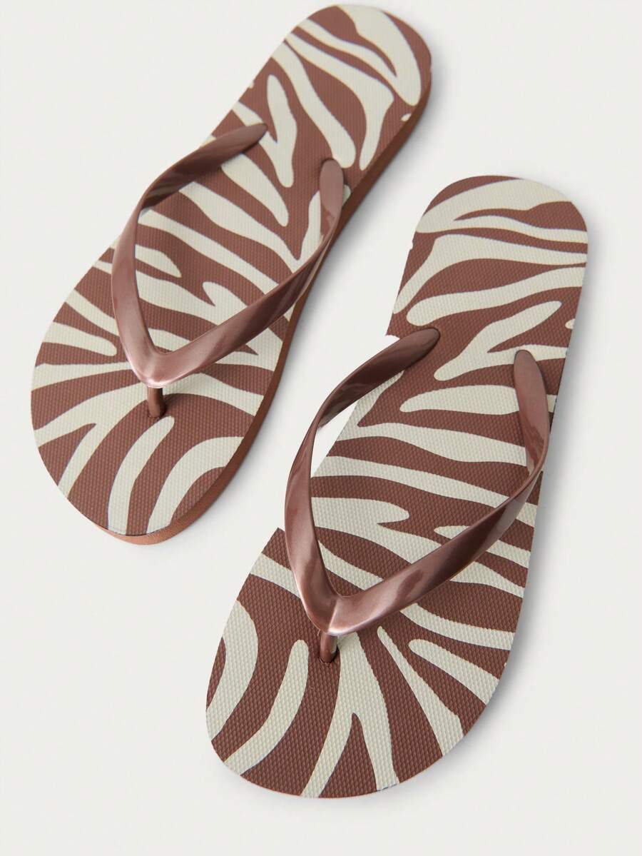 Nöista Zebra-Print Thong Sandals With Bold Animal Patterns And Bronze Straps, Bringing A Wild, Stylish Edge To Your Summer Beach Days Or Casual Spring Festival Vibes. - Brown - View 1