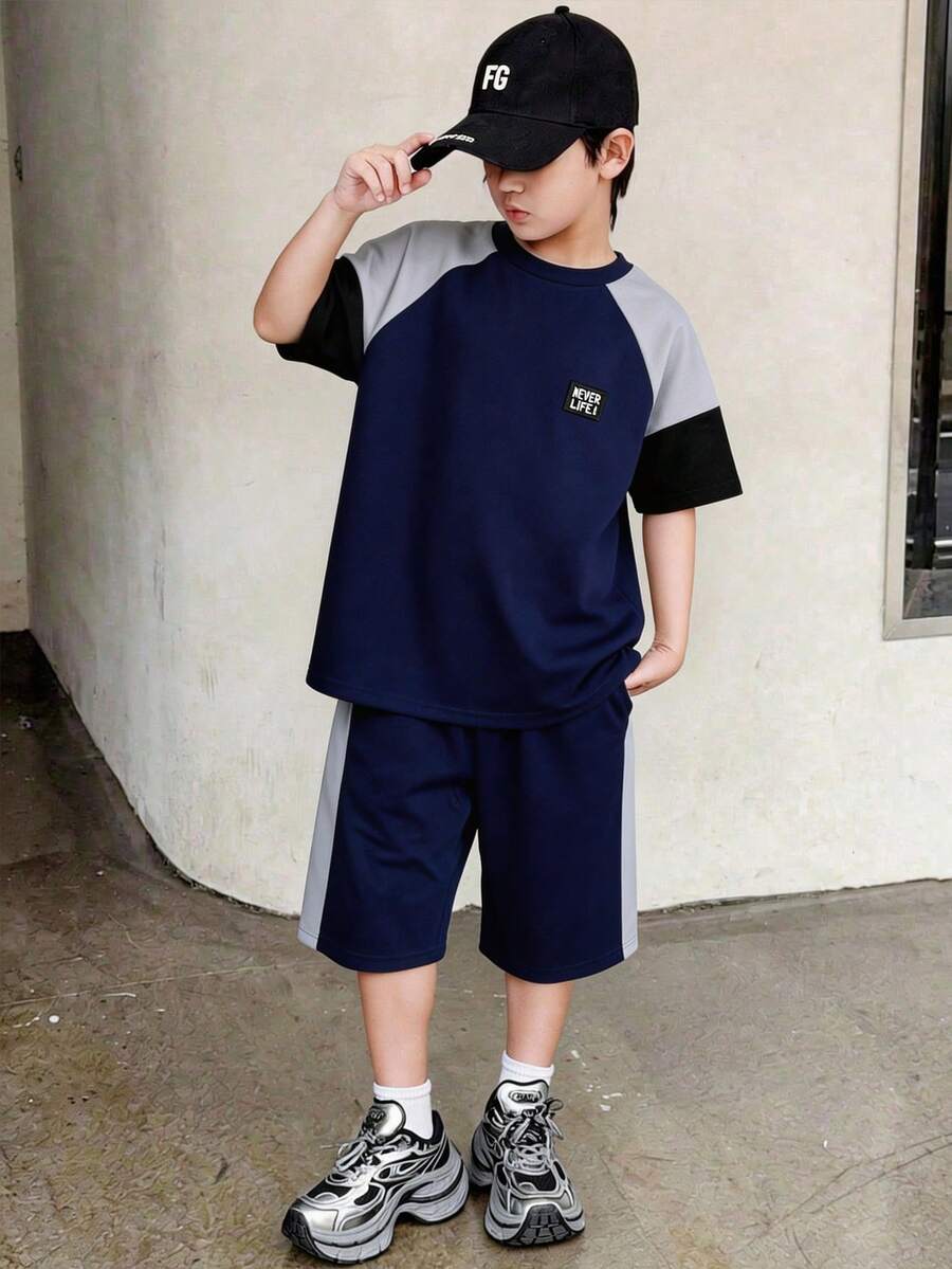 SHEIN Bộ áo thun tay raglan phối màu dành cho bé trai tuổi teen và quần short, thích hợp cho đi làm, đi học, mặc thường ngày, chơi thể thao, mùa xuân/hè. - Xanh đậm - Xem 1