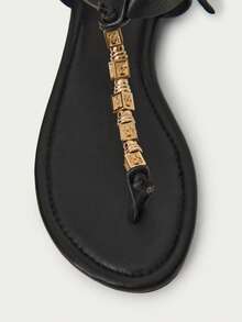 Nöista Embellished Black Thong Sandals. A Sleek Black Sandal Design Featuring A Central T-Strap Adorned With Intricate Gold Geometric Beads-The Perfect Blend Of Bohemian Flair And Refined Elegance. - Black - View 7