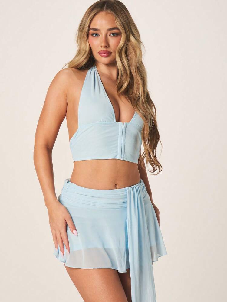 MISSGUIDED Conjunto de verano de mujer con top corto de cuello halter y minifalda envolvente en color azul claro