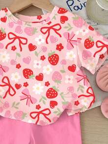 SHEIN Bộ 2 món màu hồng dễ thương in hình dâu tây, anh đào, trái tim, hoa và nơ, gồm áo thun cổ tròn tay ngắn dáng rộng thoải mái và quần đùi bó sát, thích hợp mặc hàng ngày vào mùa xuân/hè, ở nhà, đi chơi, nghỉ lễ, lễ Phục sinh, đi nông trại, dã ngoại. - Nhiều màu - Xem 6